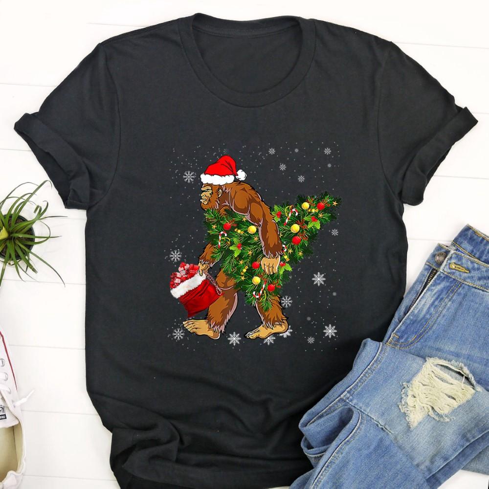 Bigfoot Carrying Christmas Tree Sasquatch Believer Pajama T Shirt Z8o5ve.jpg